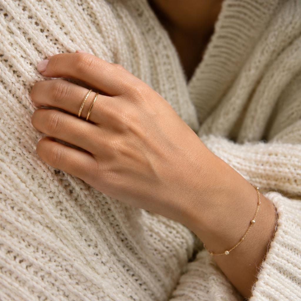 Stacked gold rings and bracelet